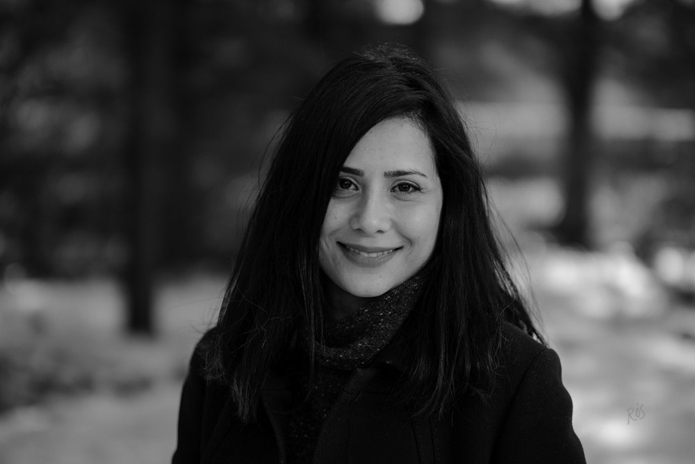 Black and white photo of a woman wiht a snowy background